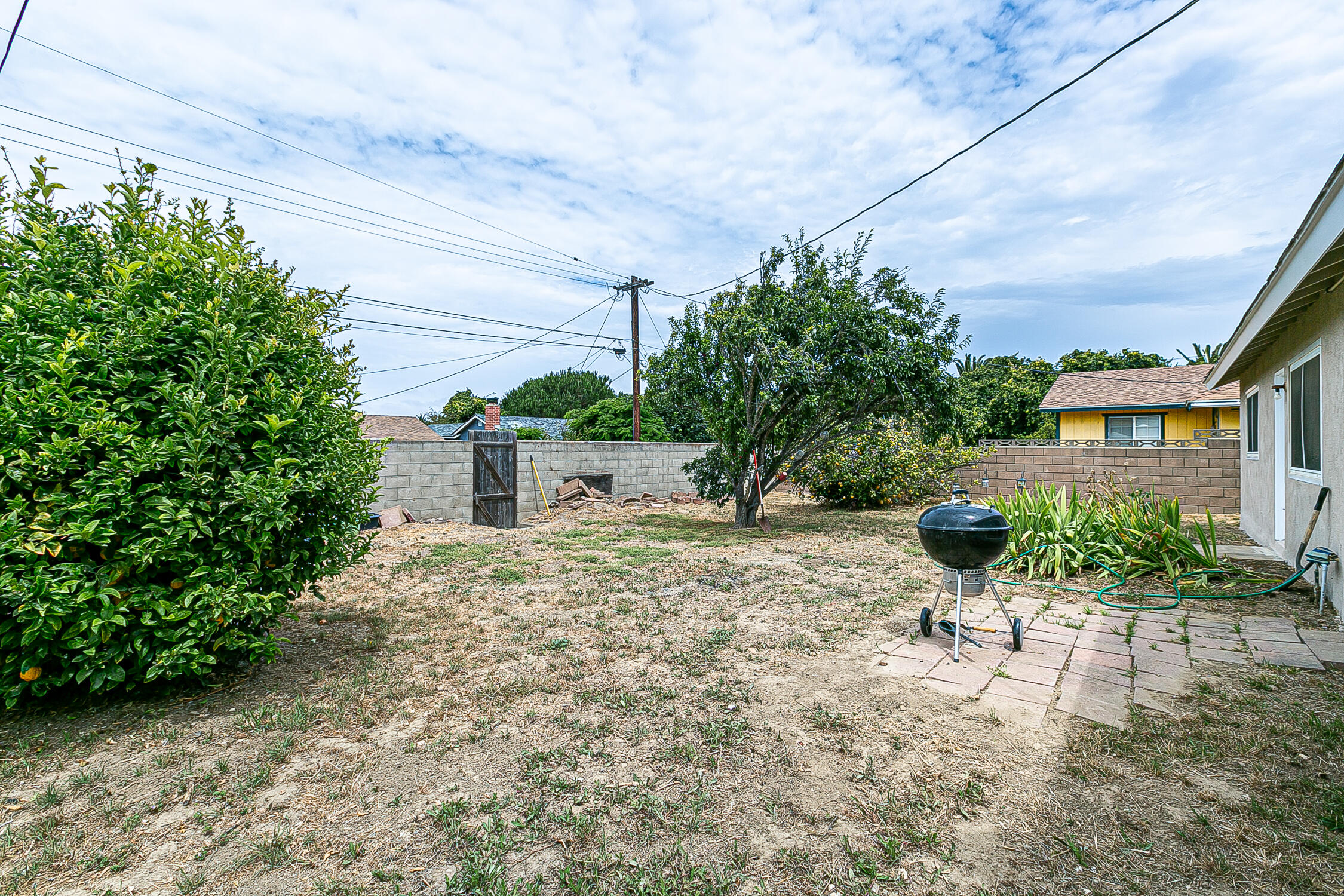 321 South T Street Lompoc, CA 93436 - Photo 26 of 29 a house with trees in front of it