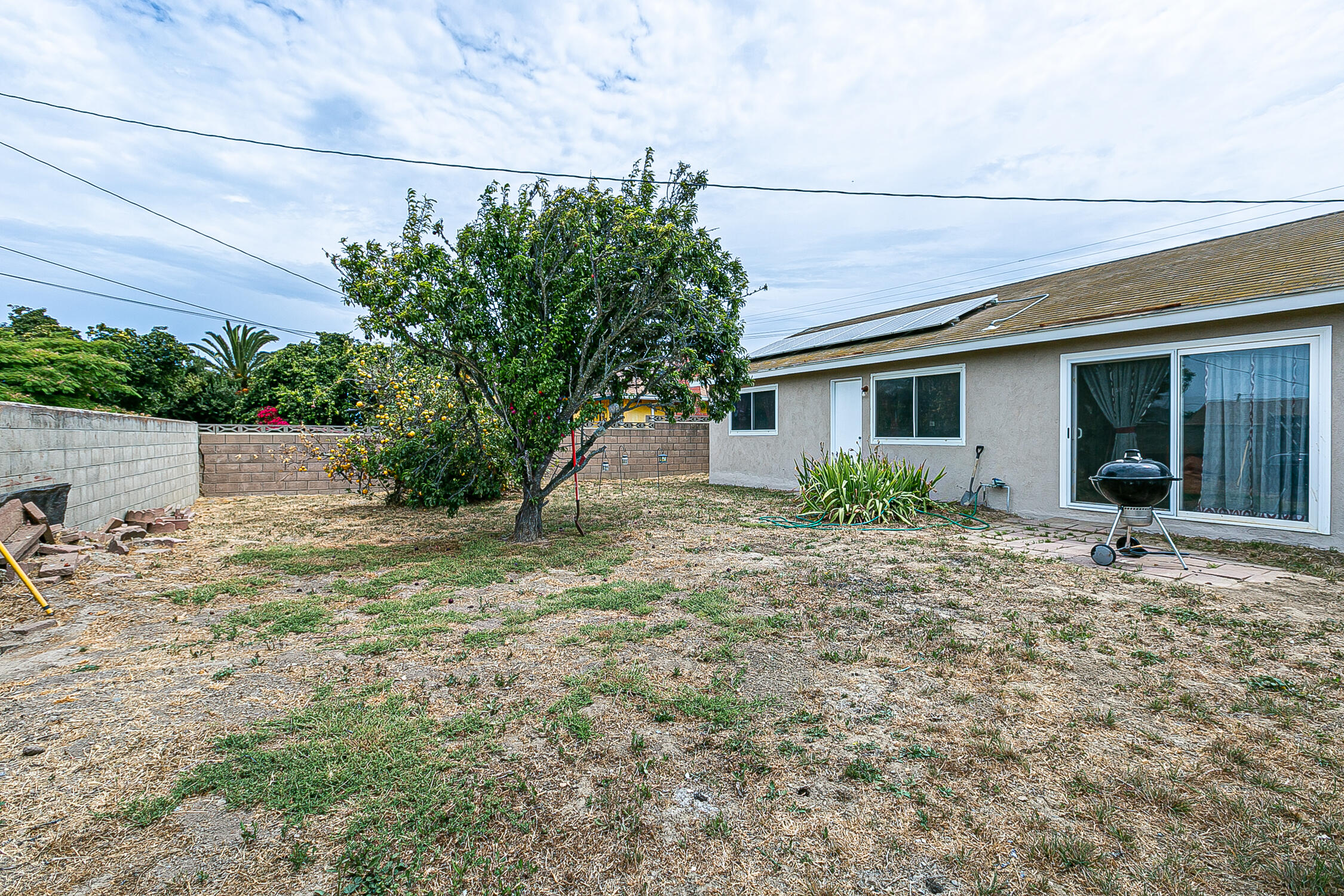 321 South T Street Lompoc, CA 93436 - Photo 27 of 29 a house with trees in front of it