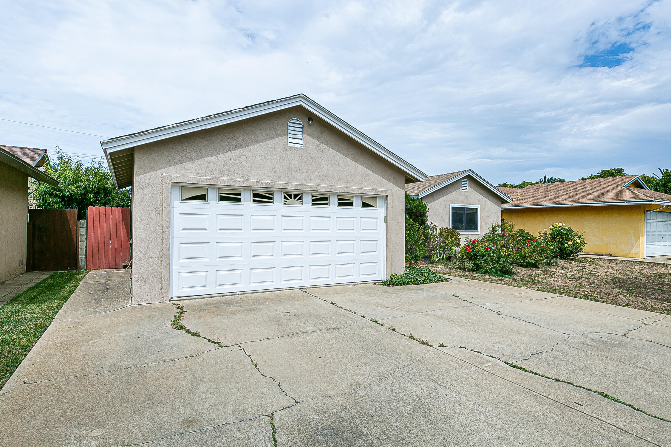321 South T Street Lompoc, CA 93436 - Photo 3 of 29 a front view of house with garage and yard