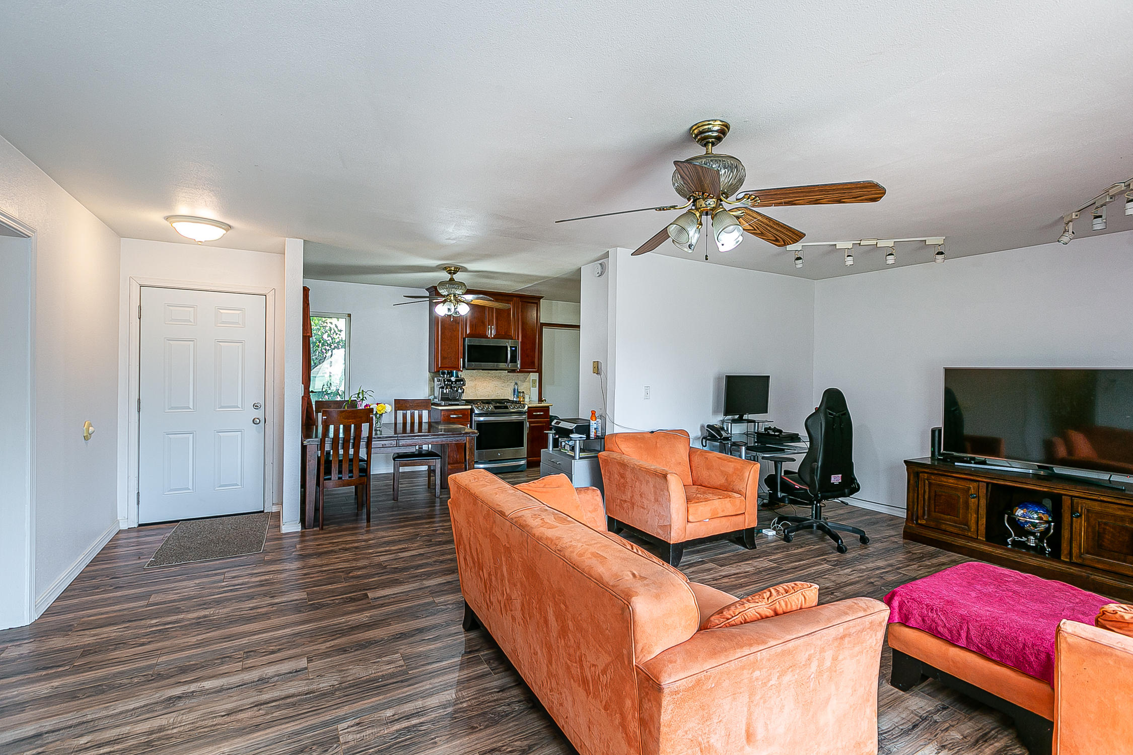 321 South T Street Lompoc, CA 93436 - Photo 5 of 29 a living room with furniture gym equipment and a flat screen tv