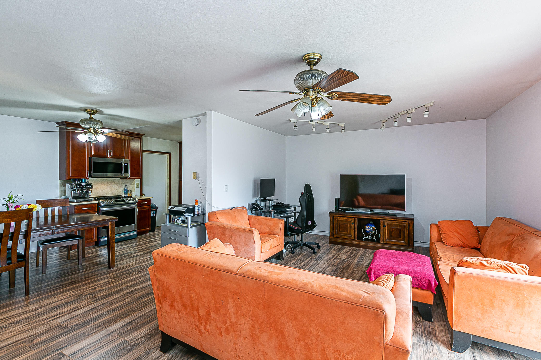 321 South T Street Lompoc, CA 93436 - Photo 6 of 29 a living room with furniture kitchen view and a flat screen tv