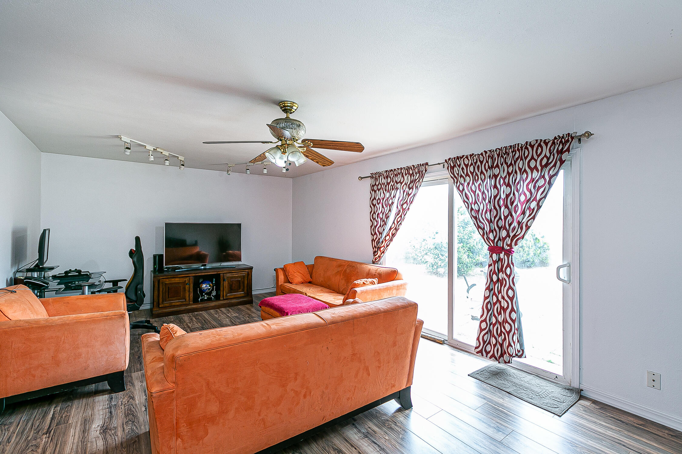 321 South T Street Lompoc, CA 93436 - Photo 7 of 29 a living room with furniture and a flat screen tv