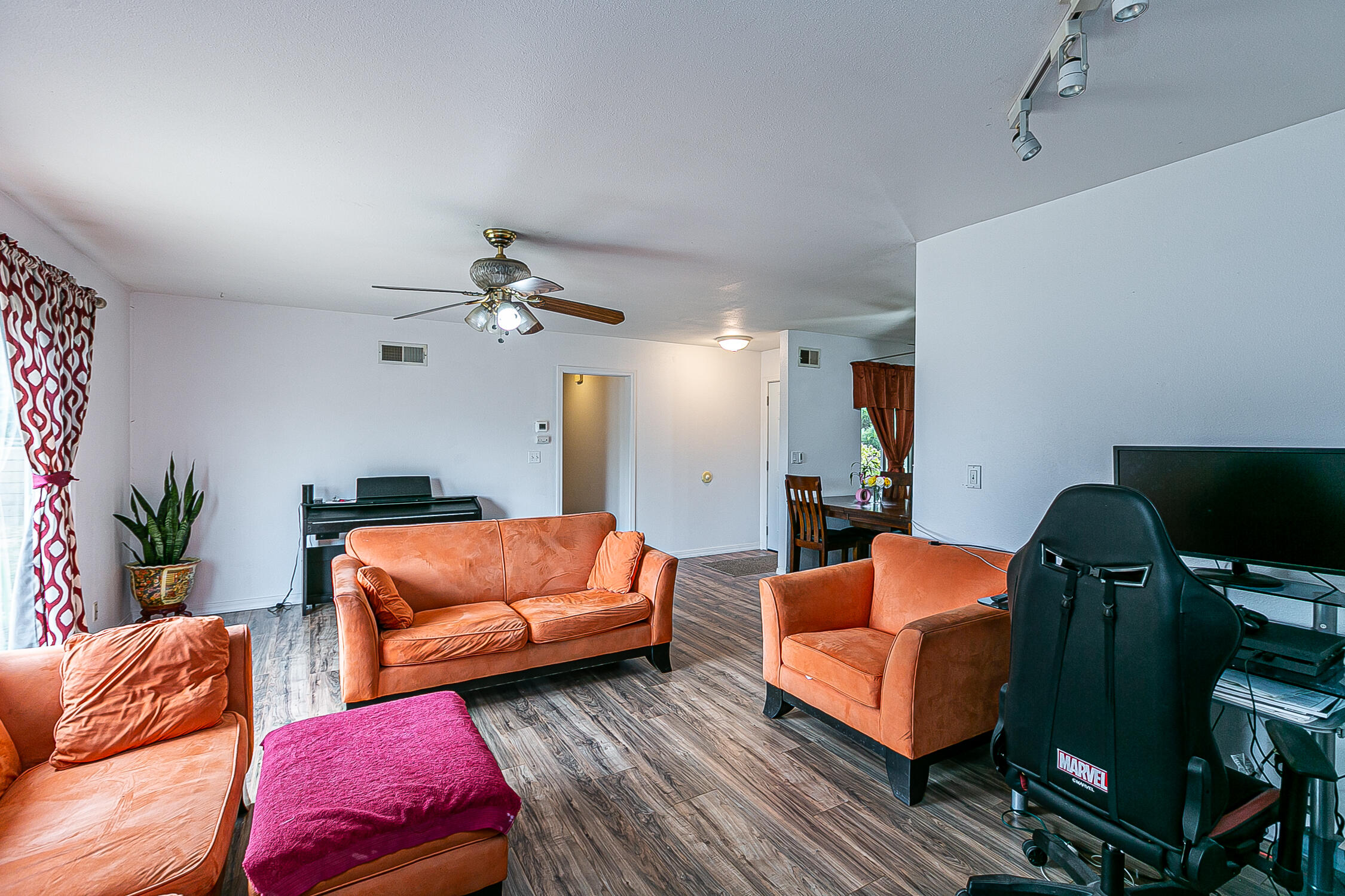 321 South T Street Lompoc, CA 93436 - Photo 9 of 29 a living room with furniture and a couch