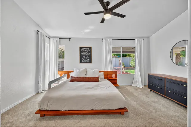 a bedroom with a bed and a dresser