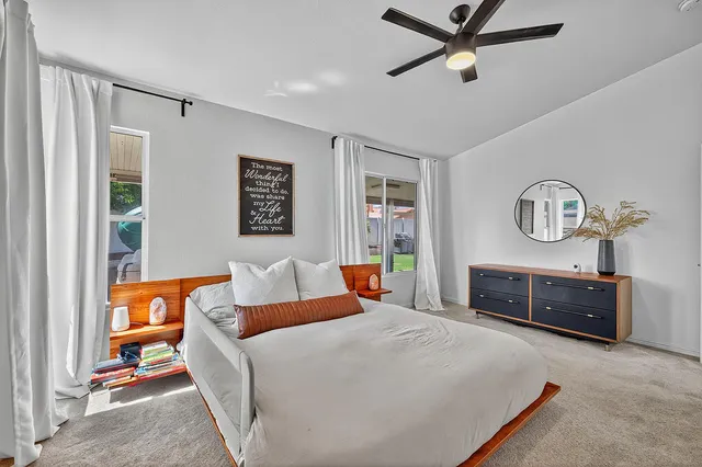 a bedroom with a bed and dresser