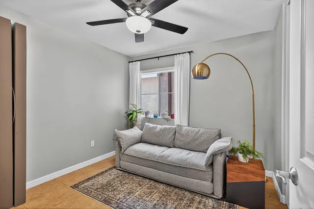 a living room with furniture and a window