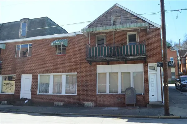 a front view of residential houses with stairs