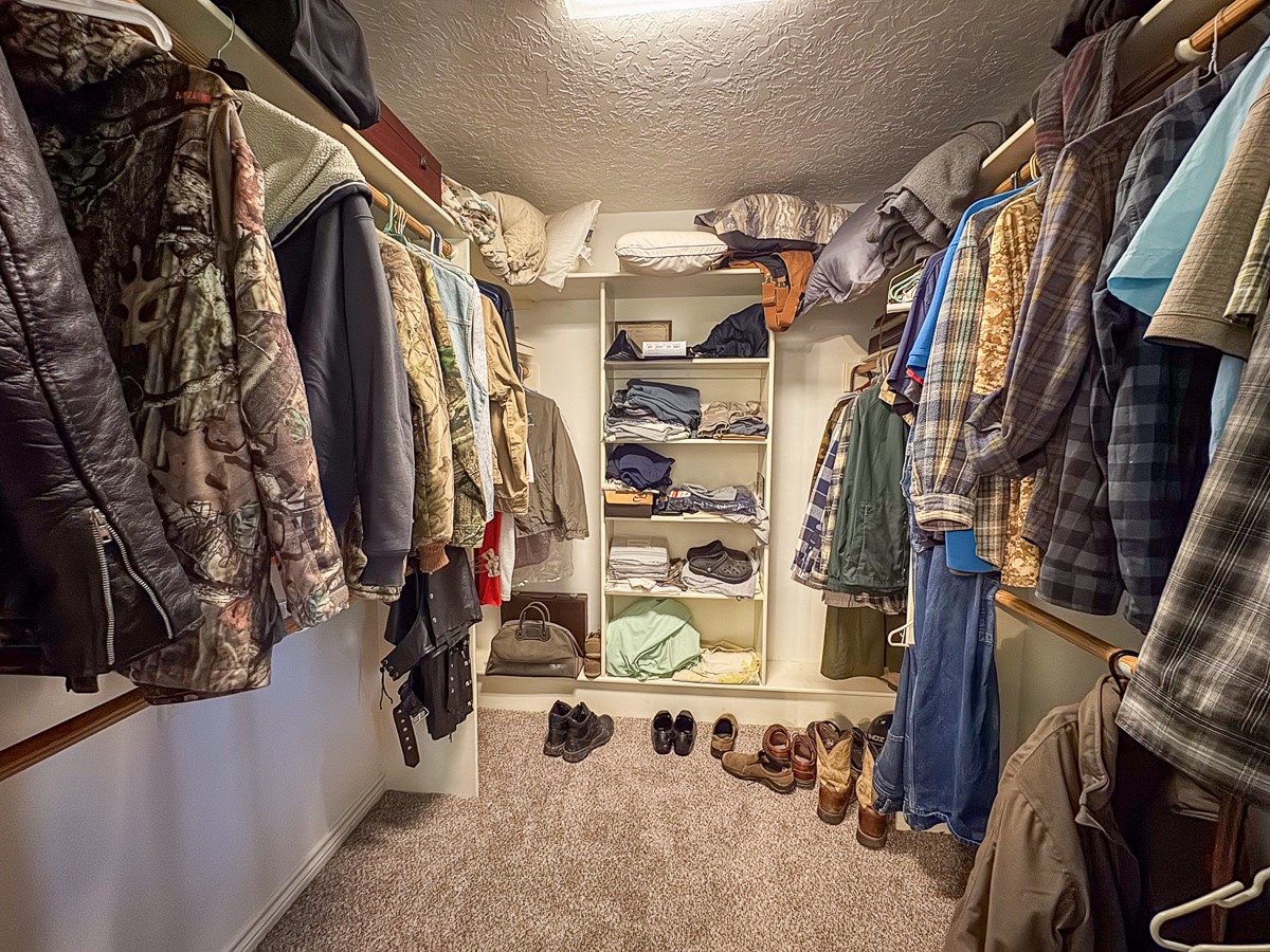 37 Archie Road Huntsville, TX 77320 - Photo 16 of 40 a view of walk in closet with clothes and shoes