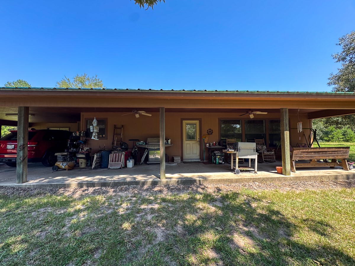 37 Archie Road Huntsville, TX 77320 - Photo 17 of 40 a view of a chairs and a room in the patio