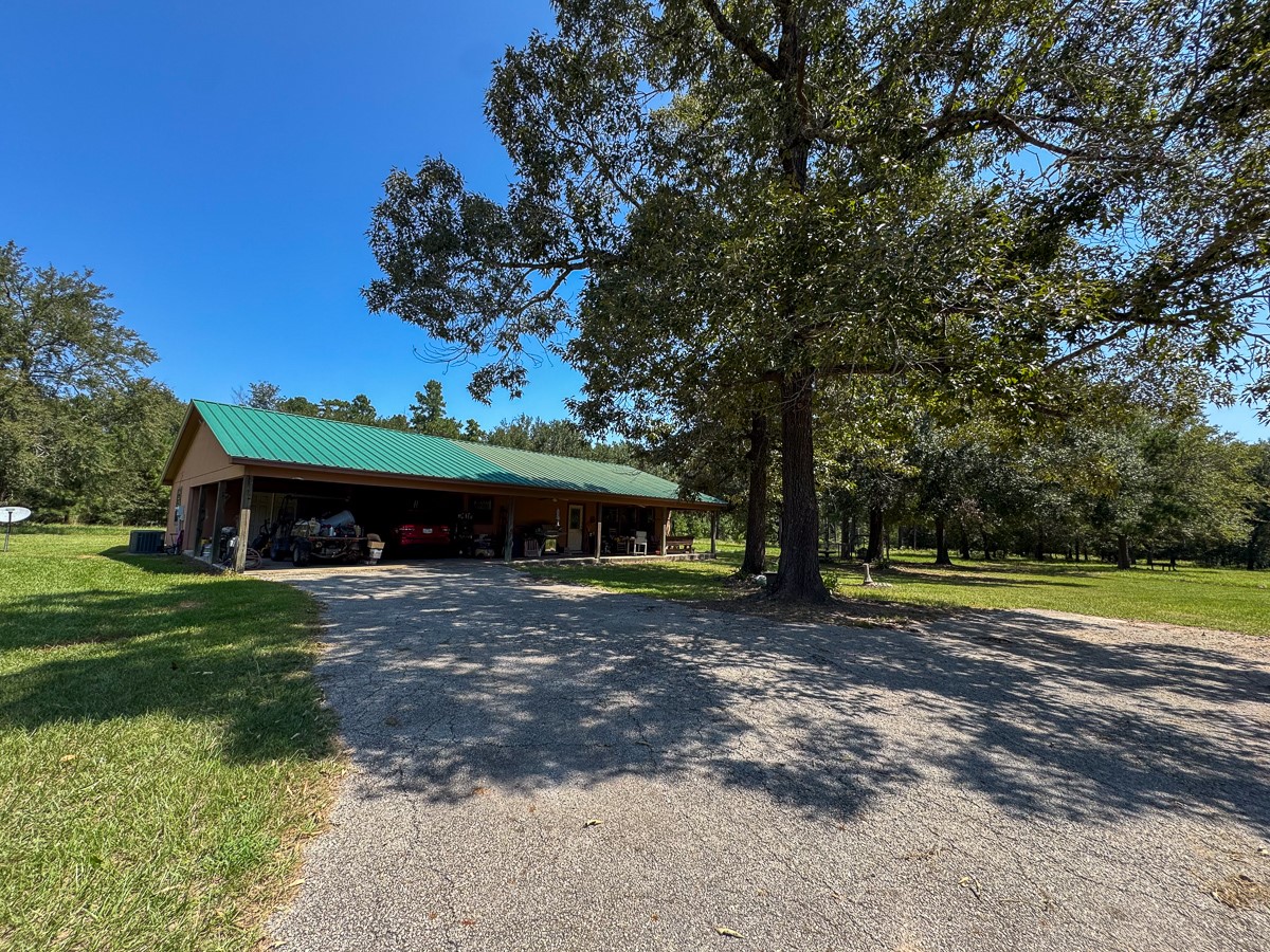 37 Archie Road Huntsville, TX 77320 - Photo 18 of 40 a front view of a house with garden