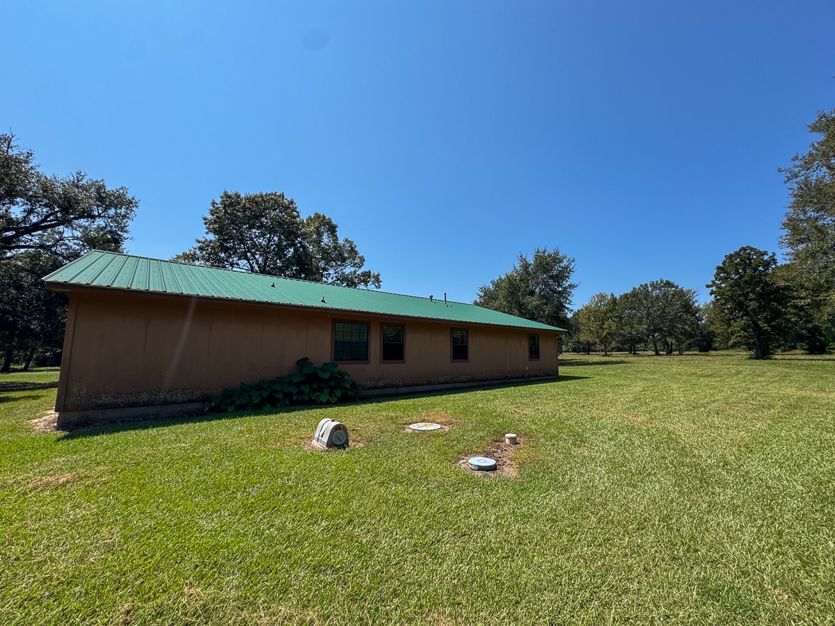 37 Archie Road Huntsville, TX 77320 - Photo 20 of 40 a backyard of a house with lots of green space