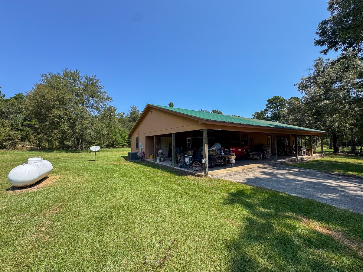 37 Archie Road Huntsville, TX 77320 - Photo 21 of 40 a view of a house with a yard