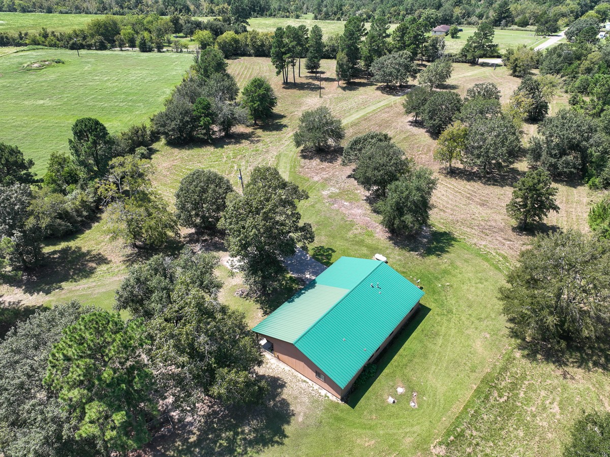 37 Archie Road Huntsville, TX 77320 - Photo 31 of 40 an aerial view of a house with a yard and lake view