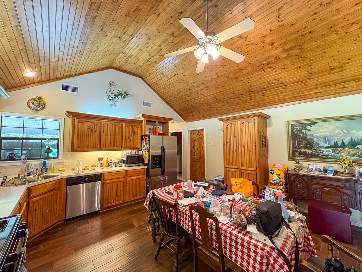 37 Archie Road Huntsville, TX 77320 - Photo 9 of 40 a kitchen with stainless steel appliances granite countertop a sink and cabinets