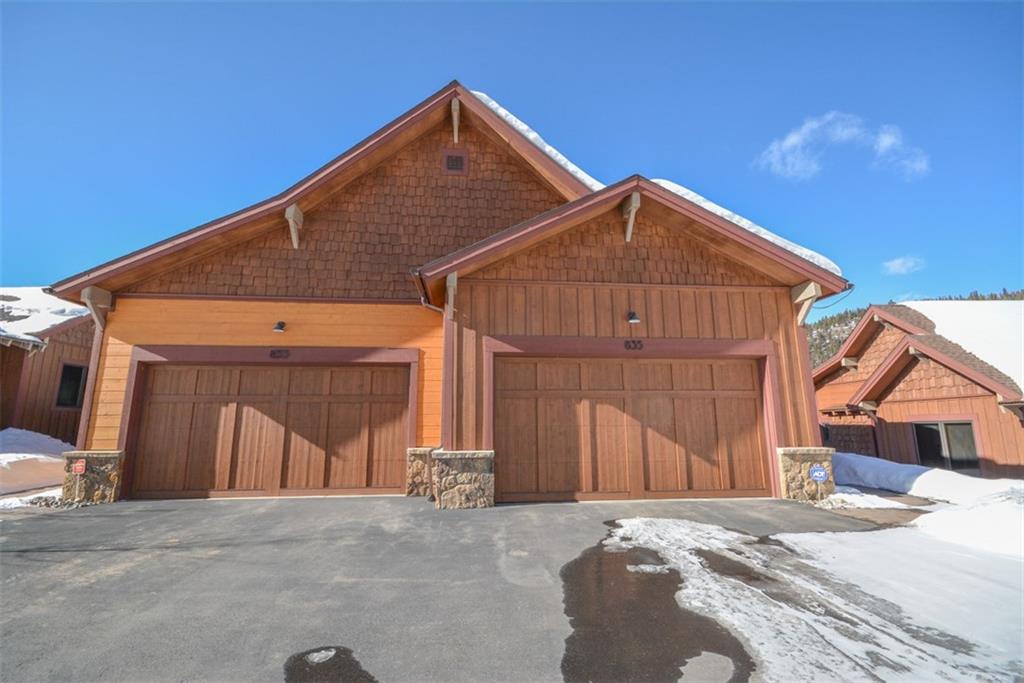 835 Independence Road, Unit 6B Keystone, CO 80435 - Photo 1 of 30 a front view of a house with a yard and garage