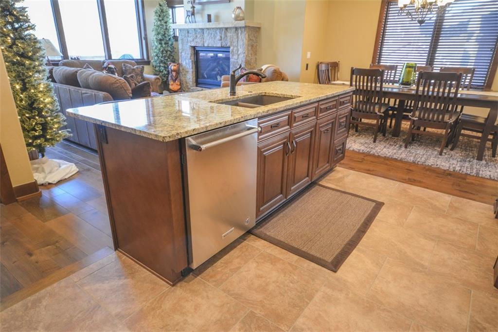 835 Independence Road, Unit 6B Keystone, CO 80435 - Photo 17 of 30 a kitchen with stainless steel appliances granite countertop a sink and a refrigerator