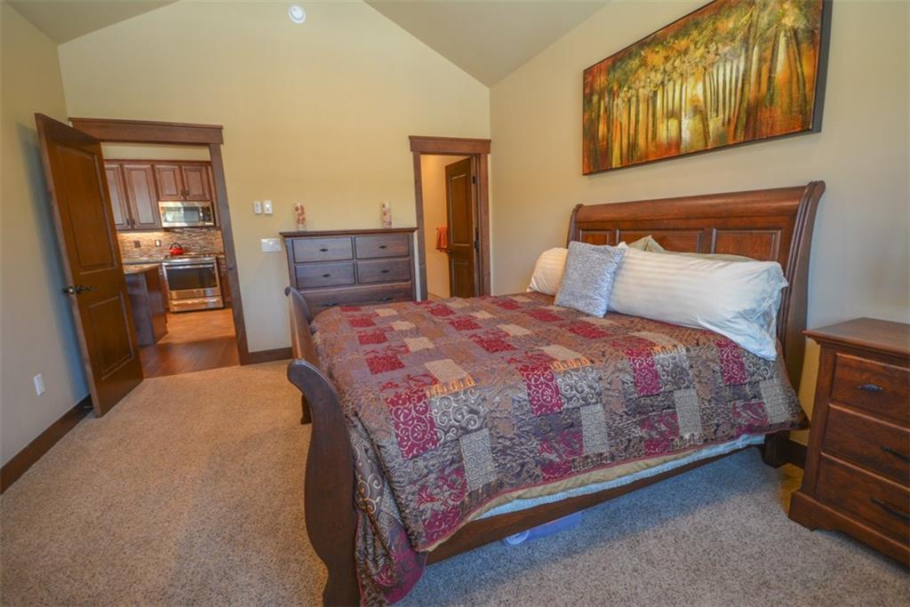 835 Independence Road, Unit 6B Keystone, CO 80435 - Photo 21 of 30 a bedroom with a bed and wooden floor