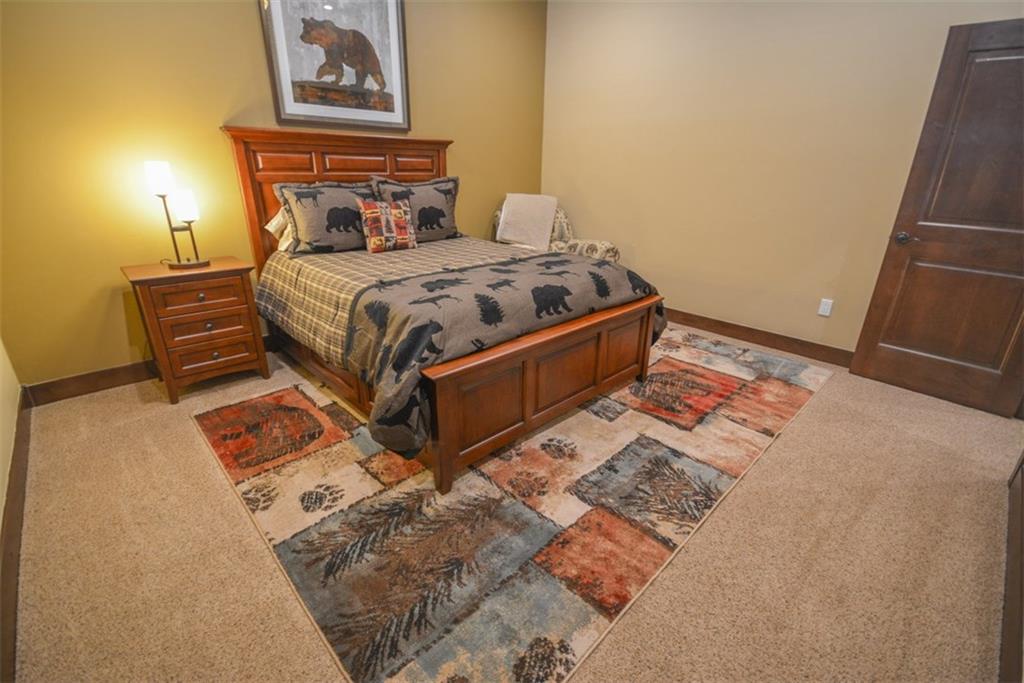 835 Independence Road, Unit 6B Keystone, CO 80435 - Photo 29 of 30 a bedroom with a bed and a lamp on dresser