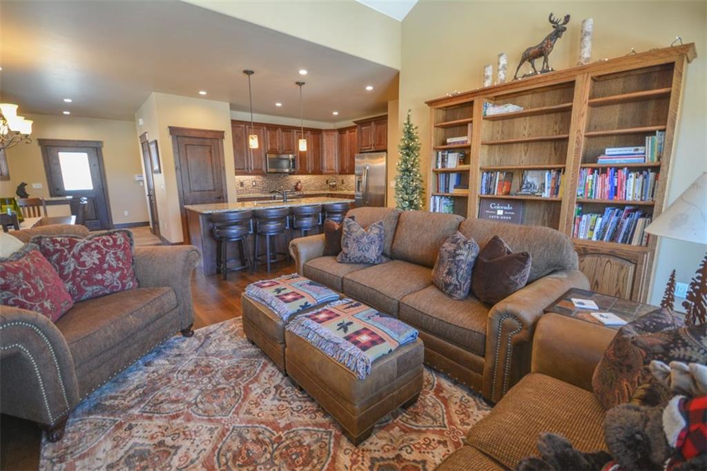 835 Independence Road, Unit 6B Keystone, CO 80435 - Photo 4 of 30 a living room with furniture and a book shelf