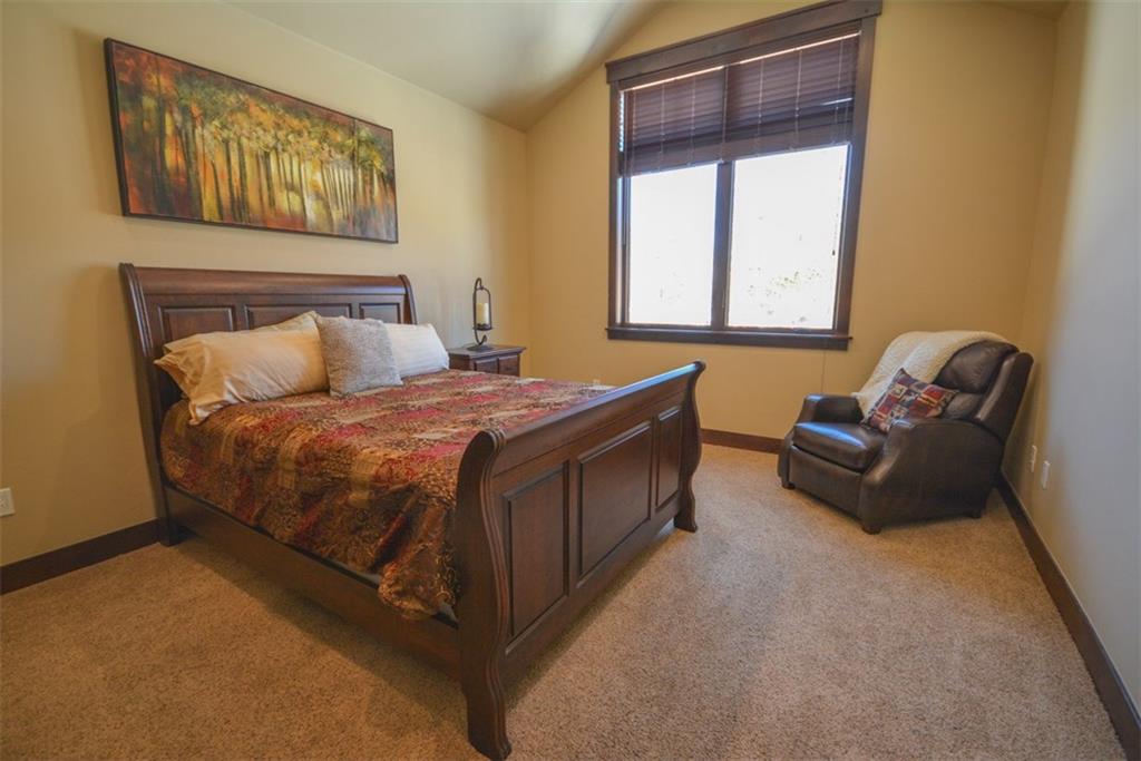 835 Independence Road, Unit 6B Keystone, CO 80435 - Photo 6 of 30 a bedroom with a bed and a couch next to a window