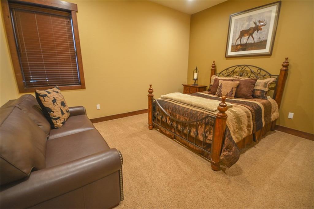 835 Independence Road, Unit 6B Keystone, CO 80435 - Photo 9 of 30 a bedroom with a bed and wooden floor