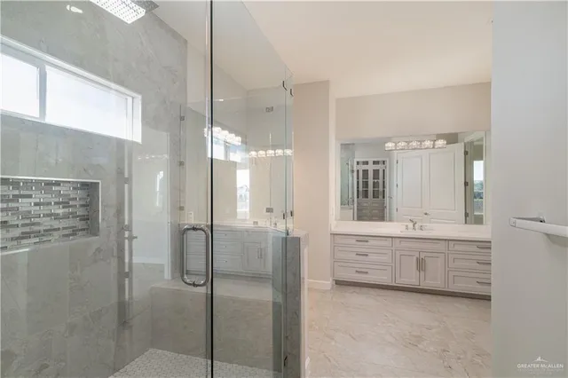 a bathroom with a tub sink and mirror