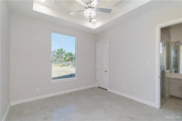 an empty room with windows and entrance