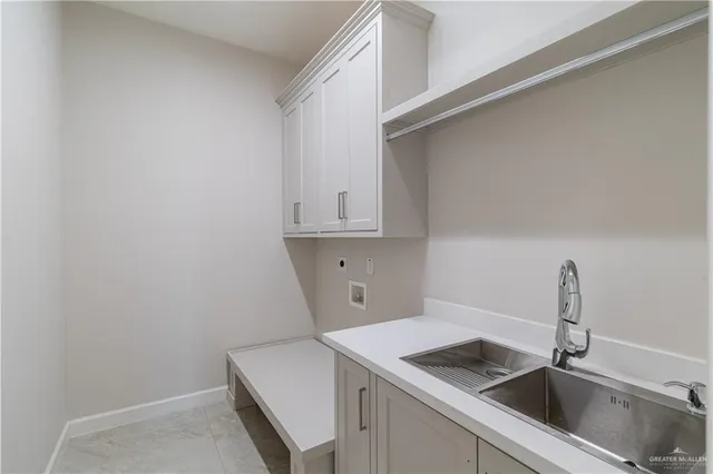 a kitchen with white cabinets
