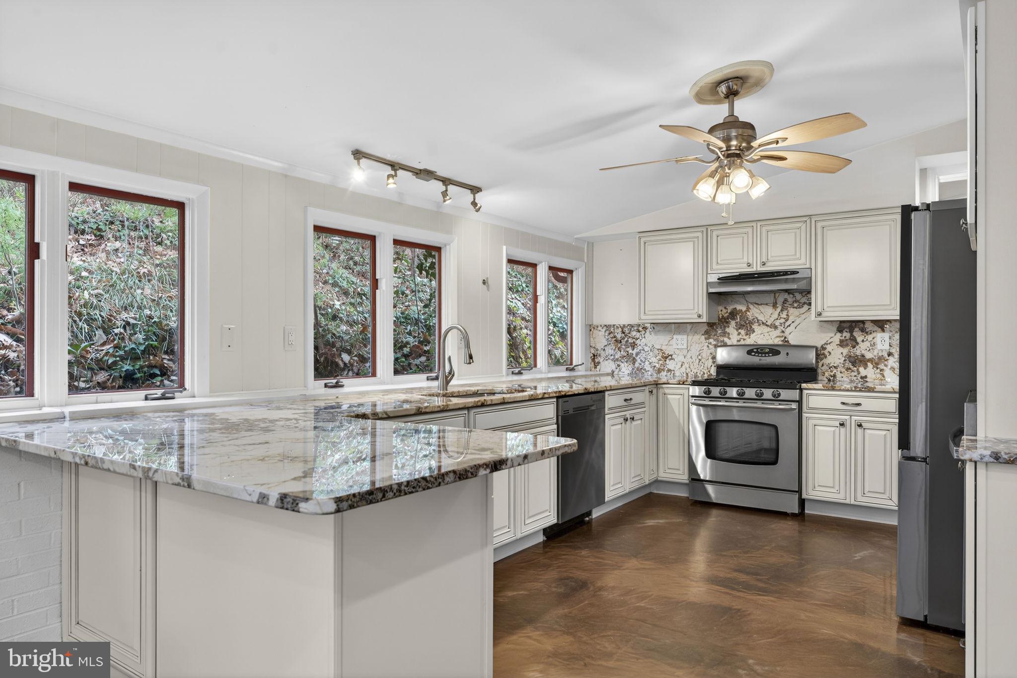 4119 Bull Run Mountain Road The Plains, VA 20198 - Photo 3 of 98 a kitchen with stainless steel appliances granite countertop a stove cabinets and a refrigerator