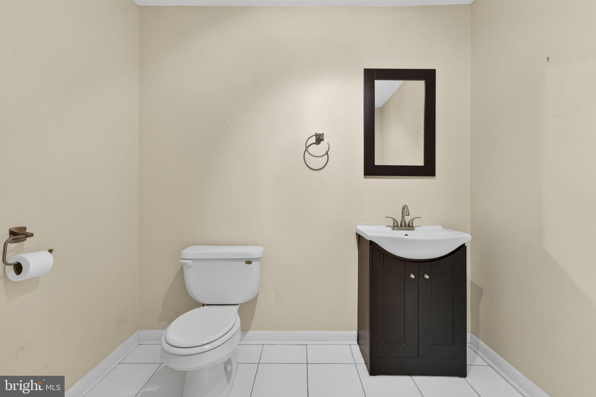 4119 Bull Run Mountain Road The Plains, VA 20198 - Photo 75 of 98 a bathroom with a toilet sink and mirror