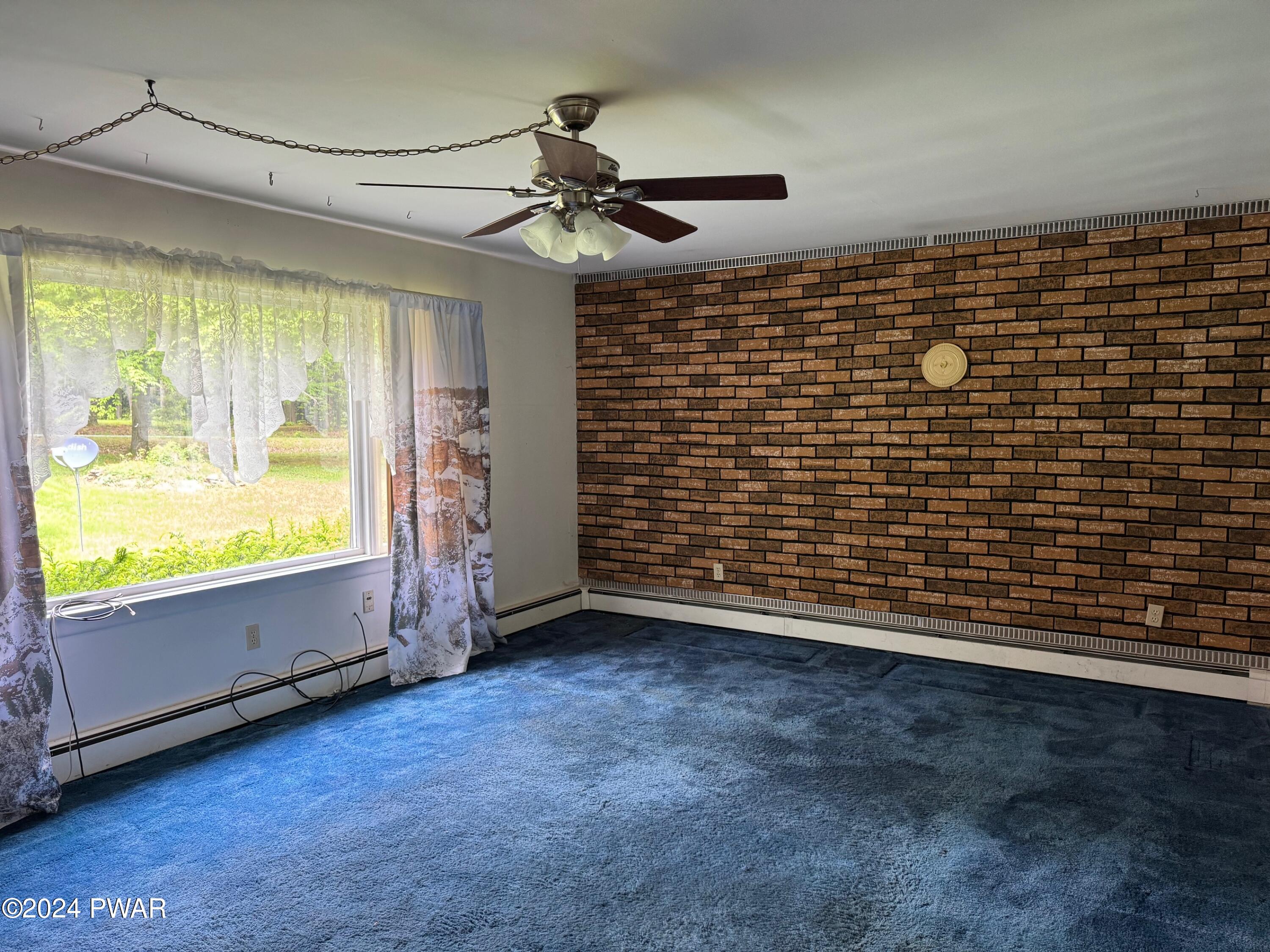 359 Canaan Road Waymart, PA 18472 - Photo 10 of 32 a view of an empty room with a window