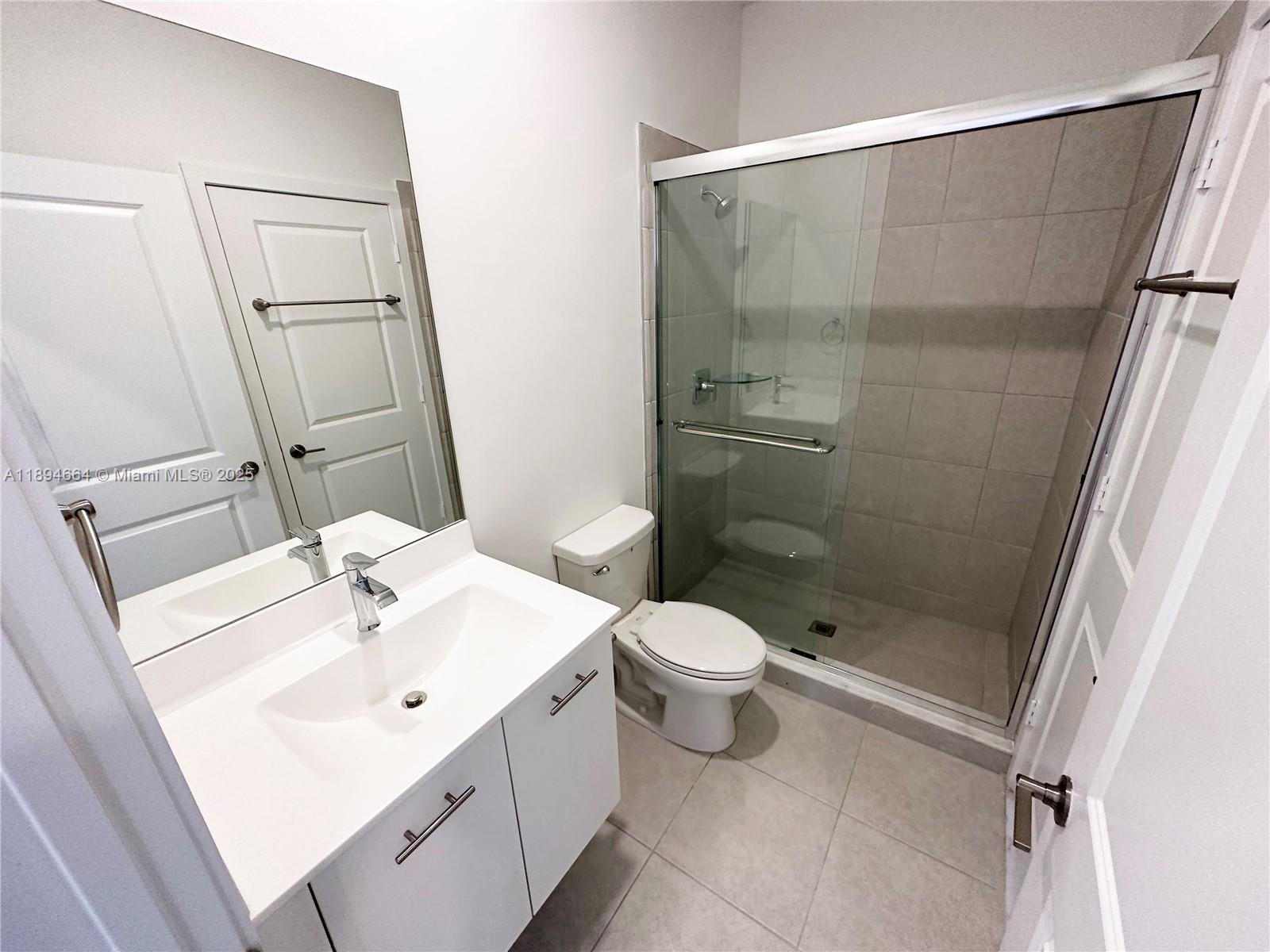 17394 Southwest 46th Street Miramar, FL 33029 - Photo 13 of 21 a bathroom with a sink a toilet and shower