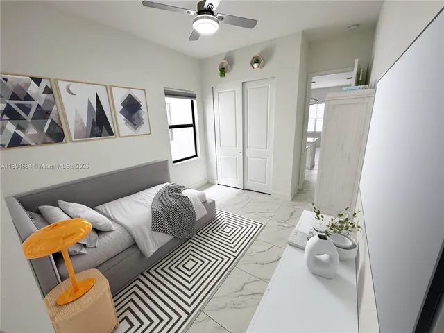 a bedroom with furniture and a chandelier