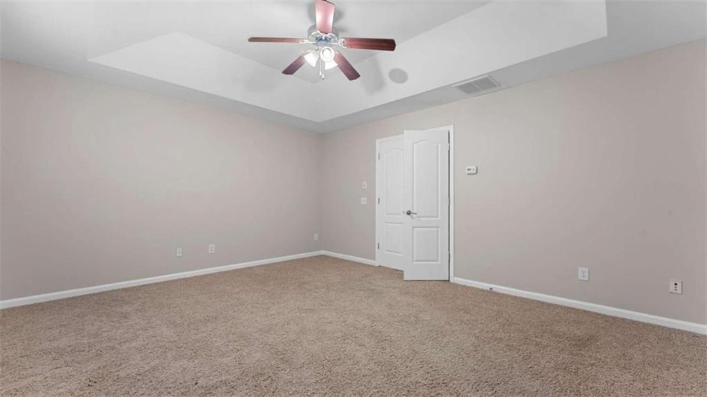 2620 Ridge Run Trail Duluth, GA 30097 - Photo 17 of 34 an empty room with a ceiling fan and a fan