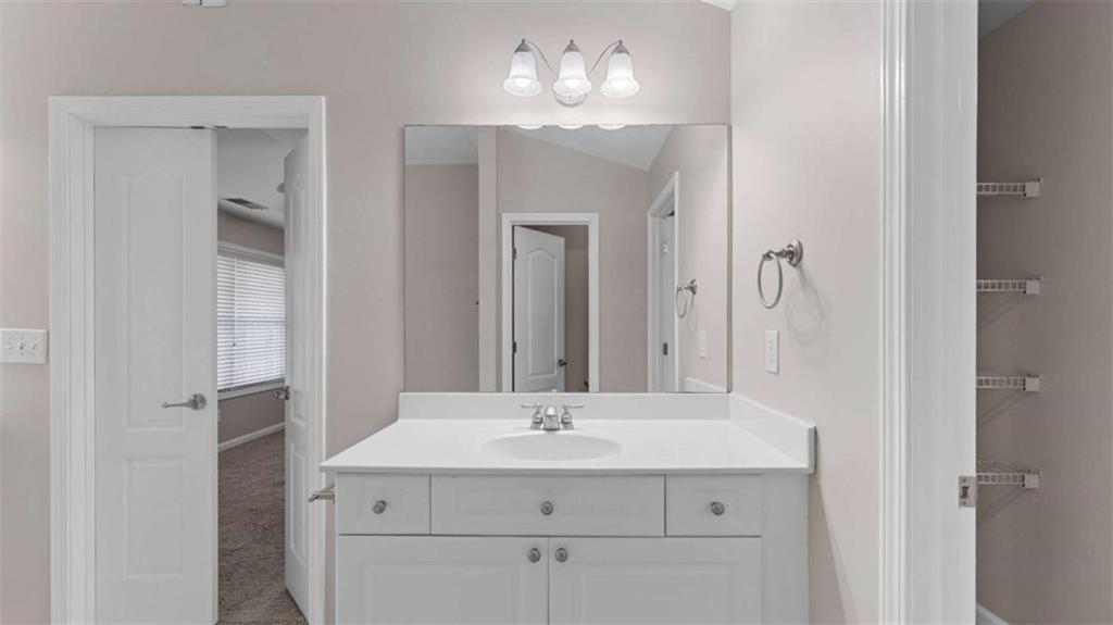 2620 Ridge Run Trail Duluth, GA 30097 - Photo 21 of 34 a bathroom with a sink double vanity and a mirror