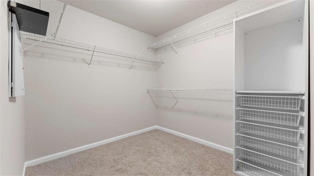 2620 Ridge Run Trail Duluth, GA 30097 - Photo 22 of 34 a view of a room with racks on the wall