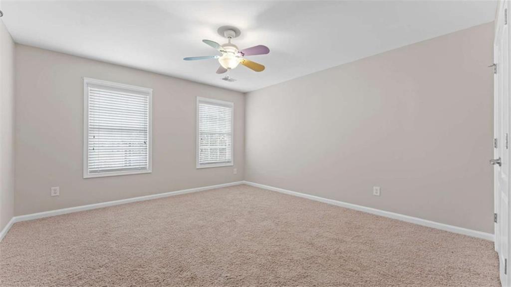 2620 Ridge Run Trail Duluth, GA 30097 - Photo 23 of 34 an empty room with windows and chandelier fan
