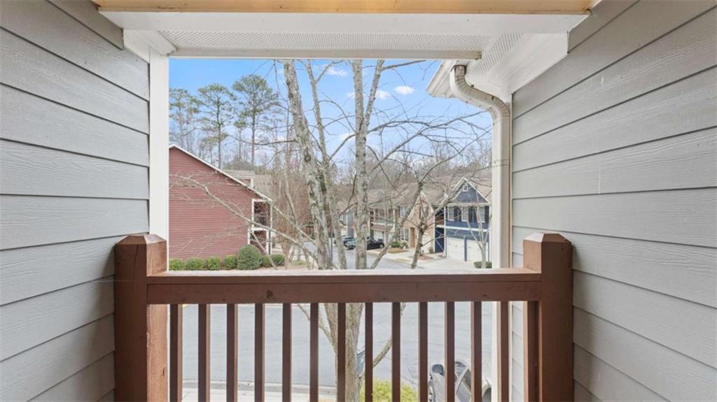 2620 Ridge Run Trail Duluth, GA 30097 - Photo 26 of 34 a view of a balcony with wooden fence and floor