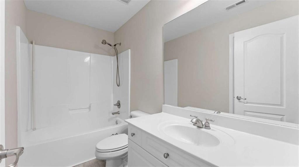 2620 Ridge Run Trail Duluth, GA 30097 - Photo 28 of 34 a bathroom with a sink a toilet and shower