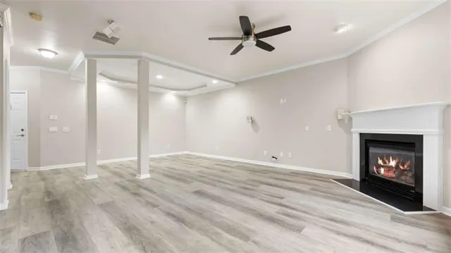 a view of an empty room and fire place