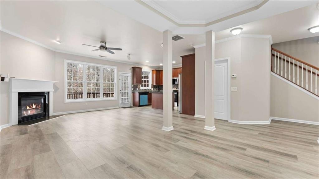 2620 Ridge Run Trail Duluth, GA 30097 - Photo 9 of 34 a view of an empty room with wooden floor fireplace and a window
