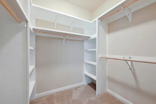 a view of an empty walk in closet
