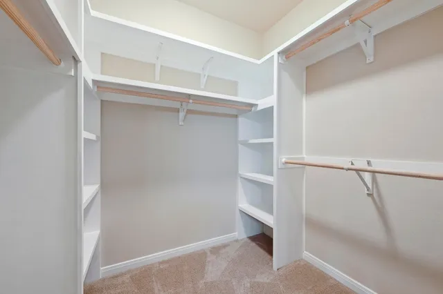 a view of an empty walk in closet