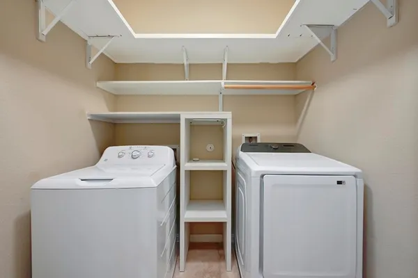 a utility room with dryer and washer
