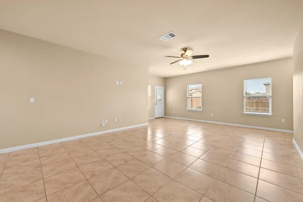 a view of an empty room with a window