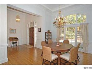 15 Catawba Ridge Road Lake Wylie, SC 29710 - Photo 2 of 16 a dining room with furniture a large window and wooden floor