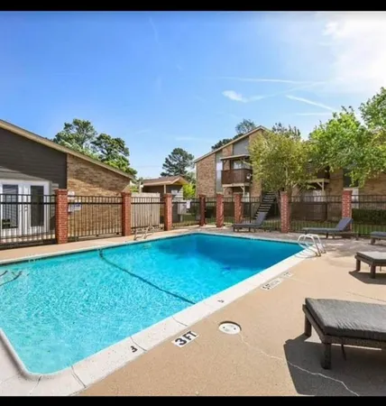 a view of a backyard with sitting area