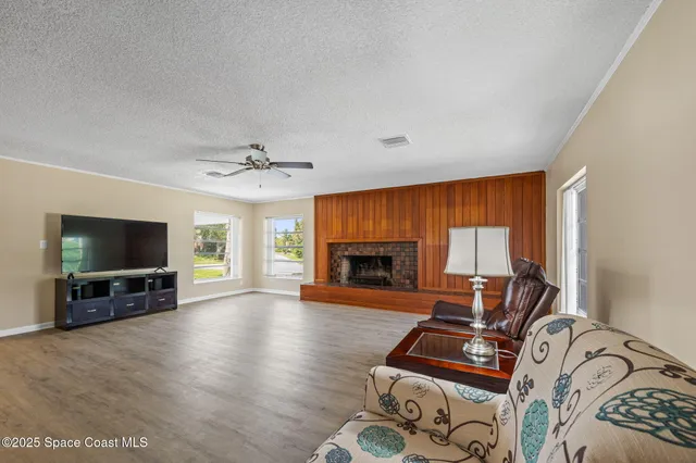a spacious bedroom with a bed and a window