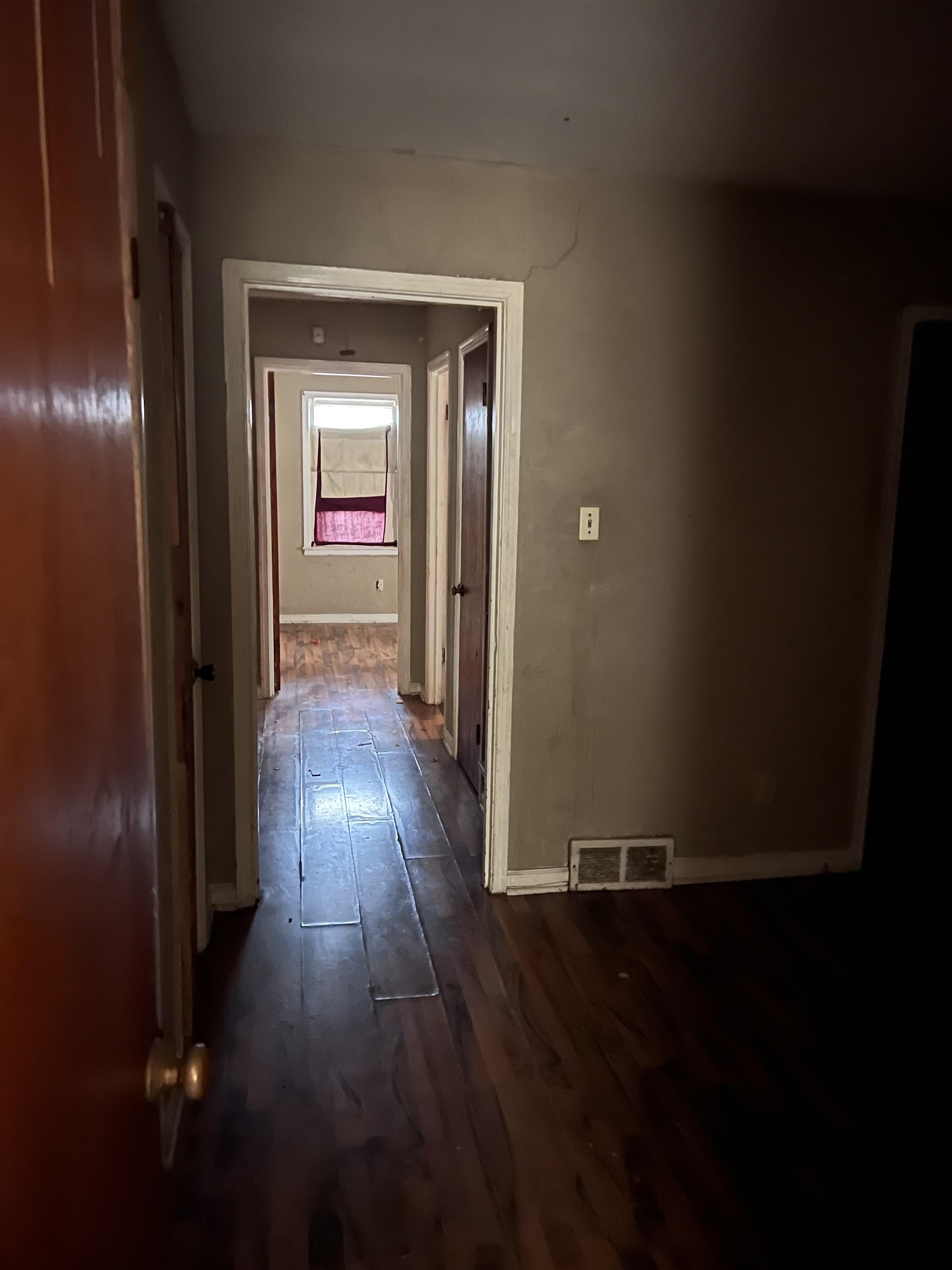 3040 South Edgeware Road Memphis, TN 38118 - Photo 11 of 12 Hall featuring baseboards and dark wood-style flooring