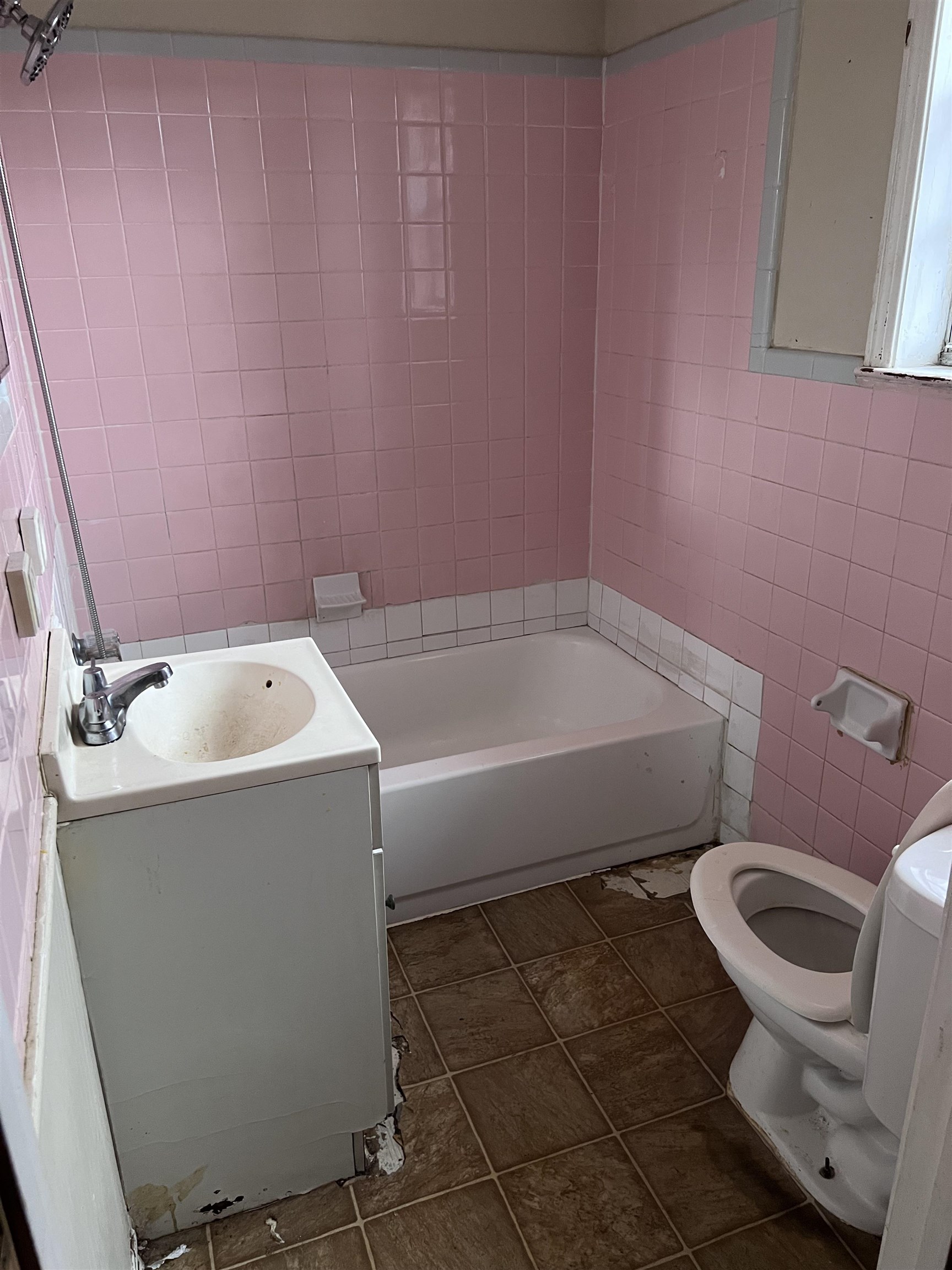 3040 South Edgeware Road Memphis, TN 38118 - Photo 5 of 12 Bathroom with tile walls, vanity, dark tile patterned flooring, and bathtub / shower combination